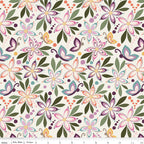 Juju's Petals Floral Cream fabric shown with a ruler for scale, featuring whimsical flowers and butterflies in pink, purple, coral, and teal on cream.