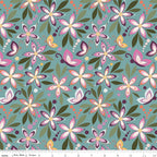 Juju's Petals Floral Teal quilting fabric shown with a ruler for scale, featuring large colorful flowers, whimsical butterflies, and green leaves on a muted teal background.