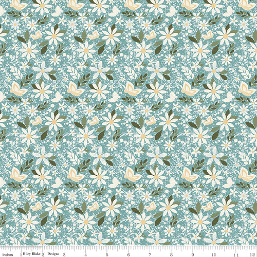 Juju's Petals Dance Teal floral quilting fabric shown with a ruler for scale, featuring cream daisies and green foliage on a teal background.