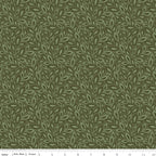 Juju's Petals Leaves Green botanical quilting fabric shown with a ruler for scale, featuring overlapping leafy branches in earthy green tones.