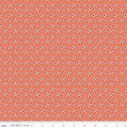 Juju's Petals Calico Orange floral fabric shown with a ruler for scale, featuring rows of colorful small flowers on a coral-orange background.