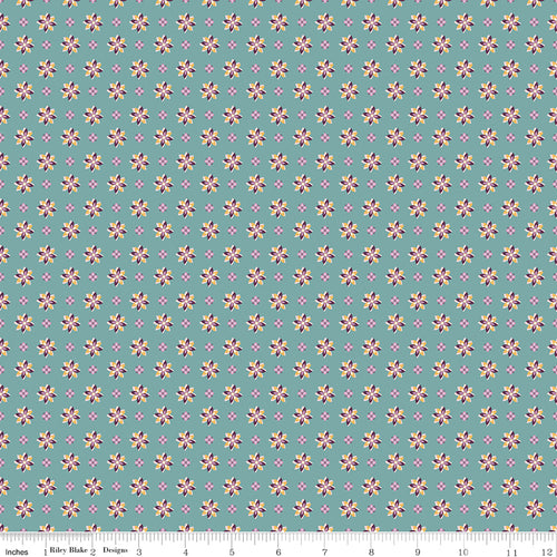 Juju's Petals Calico Teal floral quilting fabric shown with a ruler for scale, featuring rows of colorful small flowers on a teal background.