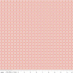 Juju's Petals Mosaic Orange fabric shown with a ruler for scale, featuring small repeating diamond and petal-shaped mosaic motifs.
