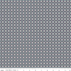 Juju's Petals Mosaic Teal fabric shown with a ruler for scale, featuring small repeating diamond and petal-shaped geometric motifs.