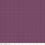 Juju's Petals Dotted Stripe Purple fabric shown with a ruler for scale, featuring narrow vertical rows of lavender-pink dots and dashes.