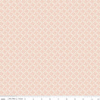 Juju's Petals Lattice Cream fabric shown with a ruler for scale, featuring a delicate small-scale coral lattice pattern on cream.