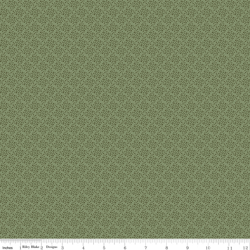 Juju's Petals Lattice Green fabric shown with a ruler for scale, featuring a delicate small-scale dark green lattice pattern on sage green.