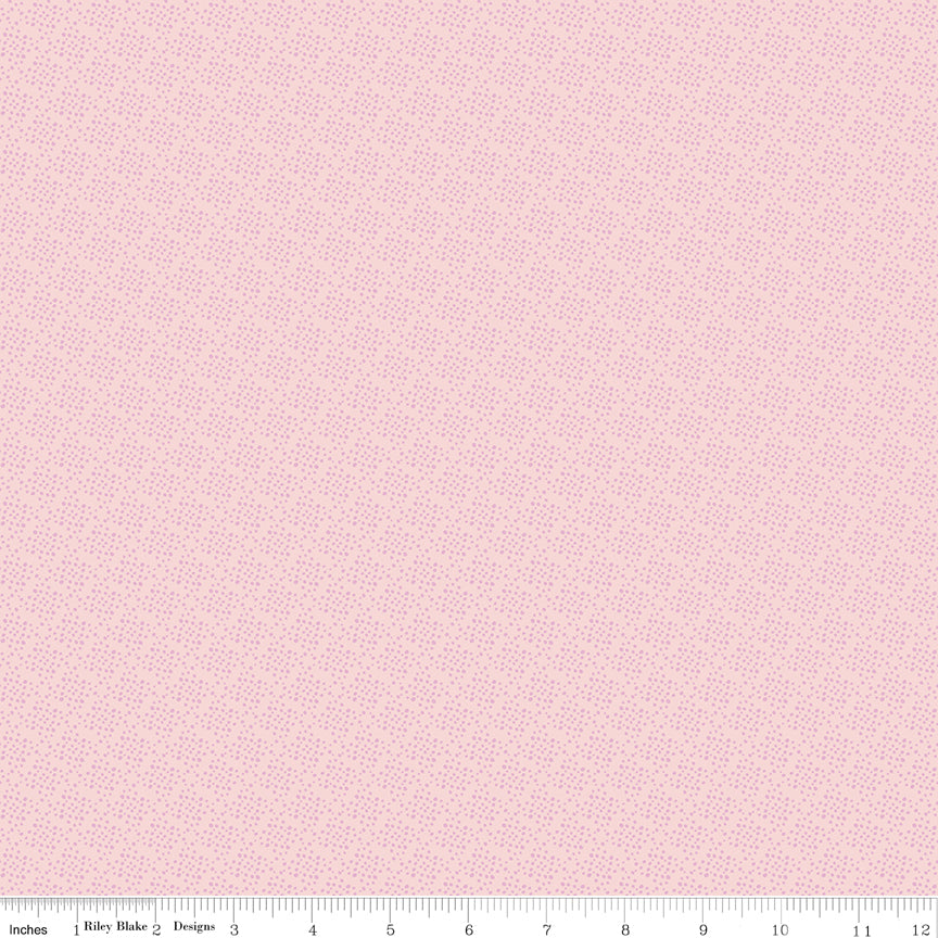 Juju's Petals Lattice Pink fabric shown with a ruler for scale, featuring a delicate small-scale pink lattice-inspired pattern.