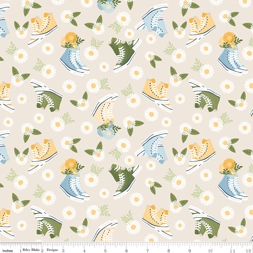 Sunshine & Dandelions Shoes Cream quilting cotton by Traci Reed for Riley Blake Designs shown with ruler for print scale
