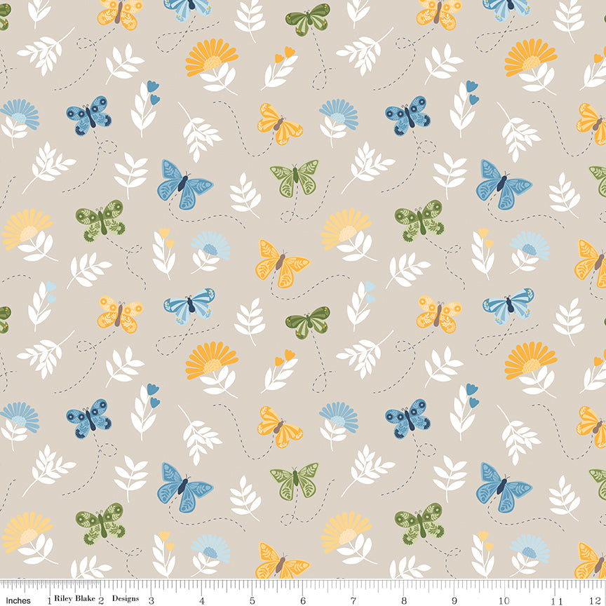 Sunshine & Dandelions Butterflies Sand quilting cotton by Traci Reed for Riley Blake Designs shown with ruler for print scale