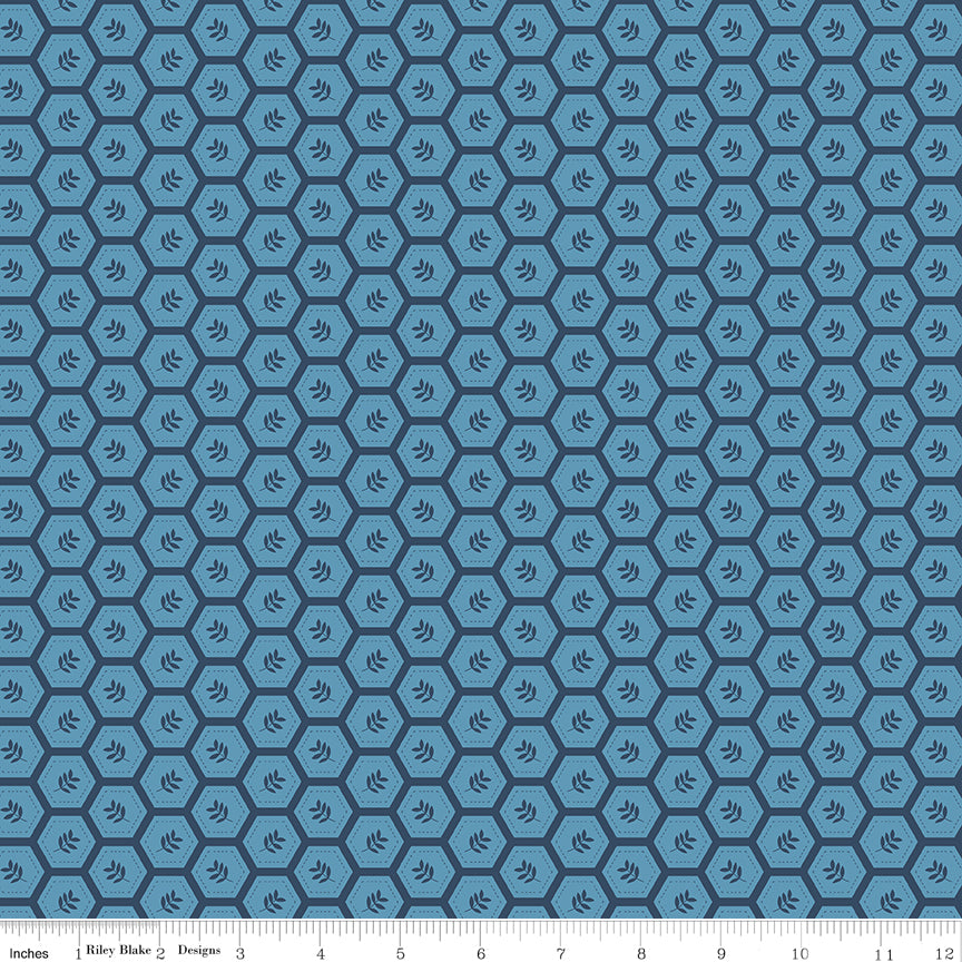 Sunshine & Dandelions Hexies Blue quilting cotton by Traci Reed for Riley Blake Designs shown with scale ruler