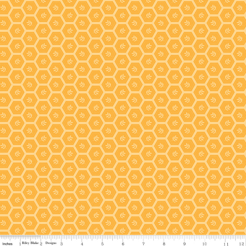 Sunshine & Dandelions Hexies Daisy quilting cotton by Traci Reed for Riley Blake Designs shown with scale ruler